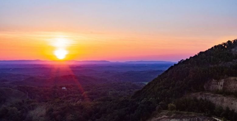 Mountains with purple, blue, yellow and orange sunset