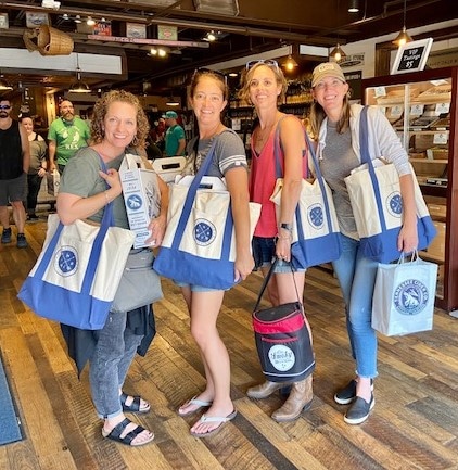 Picture of girls weekend holding purchases from alcohol tastings in Gatlinburg