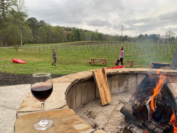 A picture of the firepit, wine, and games at Bearclaw Winery